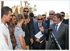 Tourists in conversation with President Mohammed Morsi at Luxor Temple